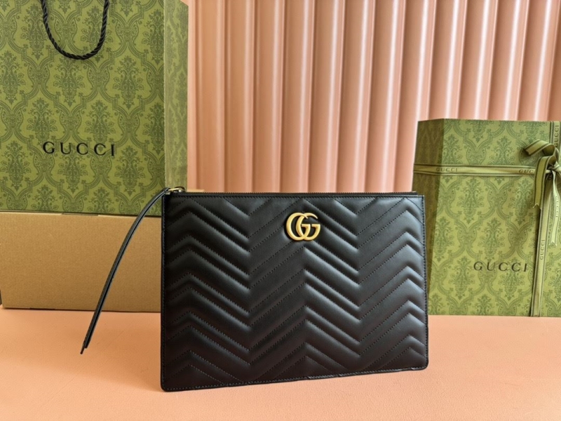 G*u*i clutch bags